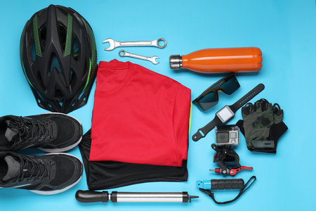 Bicycle accessories and equipment on light blue background, flat layの写真素材