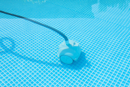One robotic cleaner in swimming pool outdoors