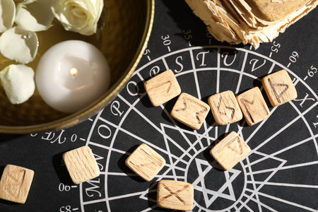 Flat lay composition with wooden runes on divination matの写真素材