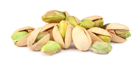 Heap of tasty pistachio nuts isolated on whiteの写真素材
