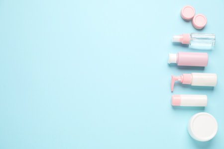 Different cosmetic products on light blue background, flat lay. Space for textの写真素材