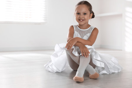 Portrait of little ballerina indoors, space for textの写真素材