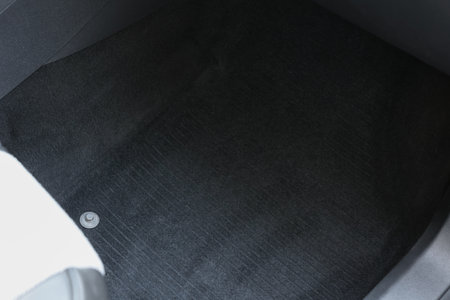 Black soft car floor mat in auto, closeupの写真素材