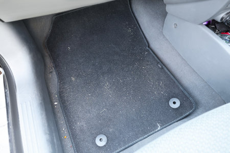 Black soft car floor mat in autoの写真素材