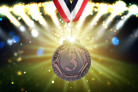 Third place bronze medal at sports field, closeupの写真素材