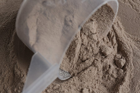Pile of protein powder and scoop, closeupの写真素材
