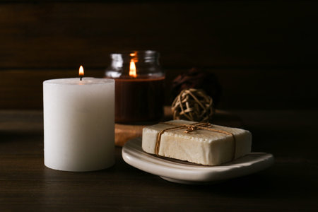 Spa composition. Burning candles and soap bar on table, closeupの写真素材