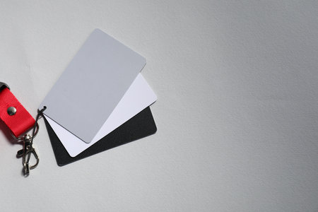 White balance calibration cards on light background, top view. Space for textの写真素材