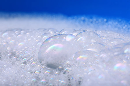 White detergent foam, closeup. Hand washing laundryの写真素材
