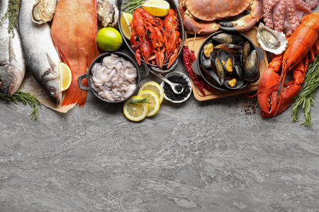 Many different sea food on gray table, top viewの写真素材