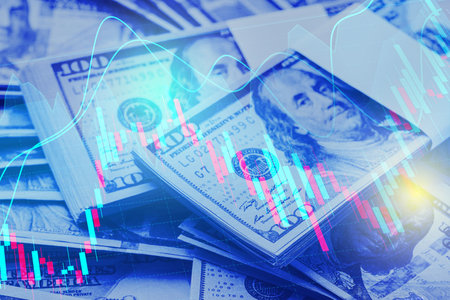Currency trading. Dollar bills and graphs, toned in blueの写真素材
