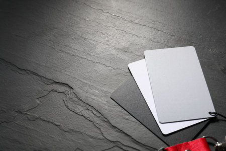 White balance calibration cards on black background, closeup. Space for textの写真素材