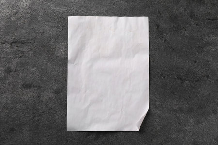 One old letter on gray table, top viewの写真素材