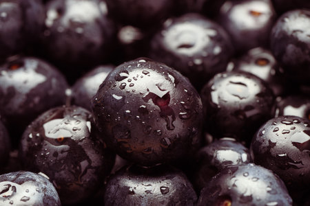 Wet acai berries as background, closeup view