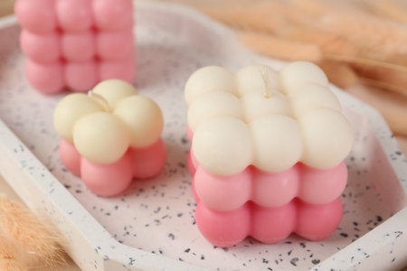 Beautiful bubble candles on tray, closeup viewの写真素材