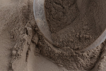 Pile of protein powder and scoop, closeupの写真素材