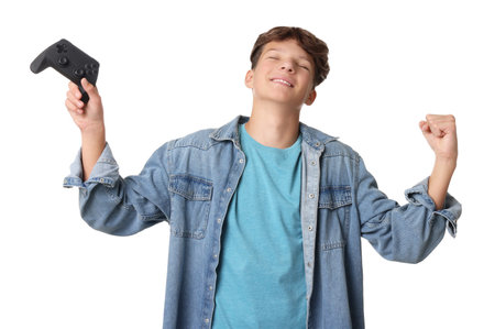 Happy teenage boy with controller on white backgroundの写真素材