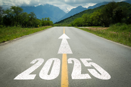 2025 and arrow on asphalt road. Concept of new year, fresh beginningの写真素材