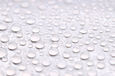 Water drops on light gray background, closeup viewの写真素材