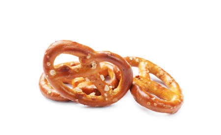 Many delicious pretzel crackers isolated on whiteの写真素材