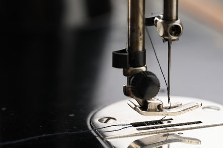 Professional sewing machine on blurred background, macro viewの写真素材