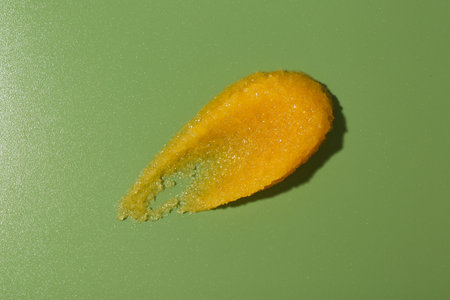 Smear of body scrub on green background, top viewの写真素材