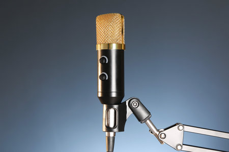 Stand with microphone on dark background. Sound recording and reinforcementの写真素材
