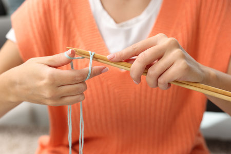 Woman knitting with needles at home, closeupの写真素材