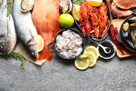 Many different sea food on gray table, top viewの写真素材