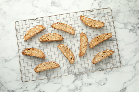 Traditional Italian almond biscuits (Cantucci) on white marble table, top viewの写真素材