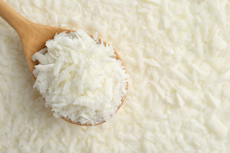 White soy wax flakes and spoon, closeupの写真素材