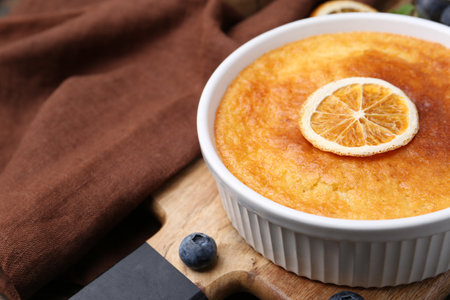 Tasty semolina cake served on wooden table, closeup. Space for textの写真素材