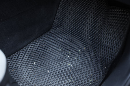Gray rubber car floor mat in autoの写真素材