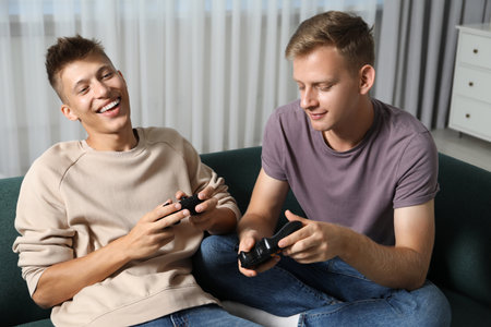 Two people enjoying video games together at home