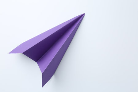 One handmade purple paper plane on white background, top view. Space for textの写真素材