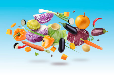 Many different fresh vegetables in air on blue gradient backgroundの写真素材