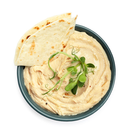 Hummus in bowl and pita isolated on white, top viewの写真素材