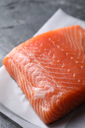 Piece of fresh salmon on table, closeupの写真素材
