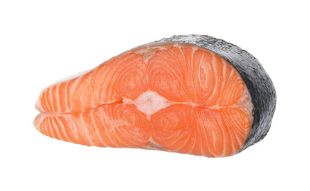 Steak of fresh raw salmon isolated on whiteの写真素材