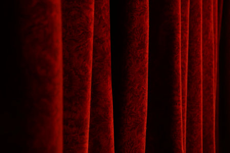 Elegant red curtains in theater as background, closeupの写真素材