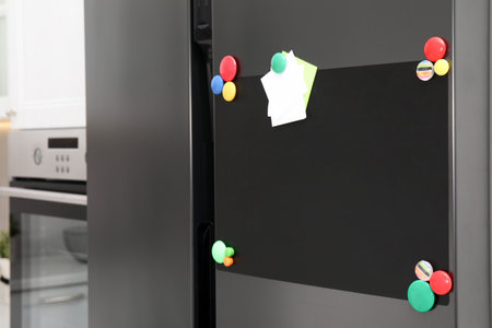 Blank magnetic board with notes on refrigerator in kitchenの写真素材