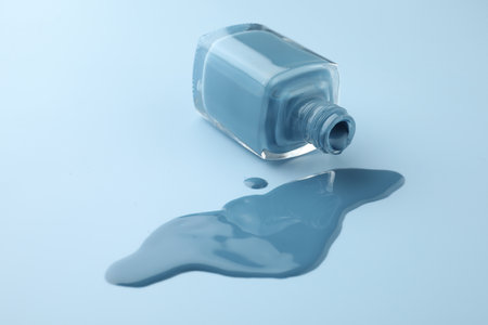 Bottle of nail polish on light blue background, closeupの写真素材