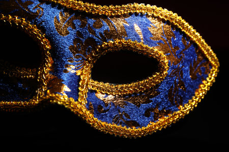 Beautiful blue carnival mask on black background, closeupの写真素材