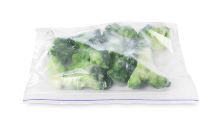 Frozen broccoli in plastic bag isolated on whiteの写真素材