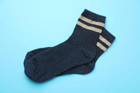 Pair of soft comfortable socks on light blue background, top viewの写真素材