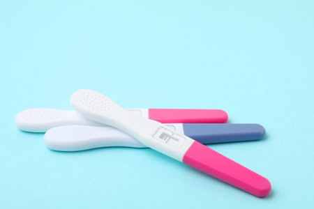 Pregnancy tests on light blue background, closeupの写真素材