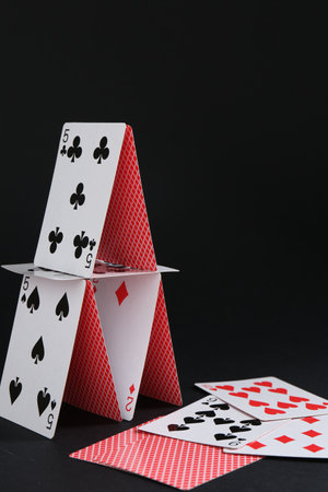 House of playing cards on black backgroundの写真素材