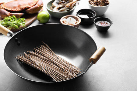 Different ingredients for wok on light gray tableの写真素材