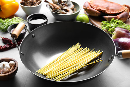 Different ingredients for wok on light gray tableの写真素材