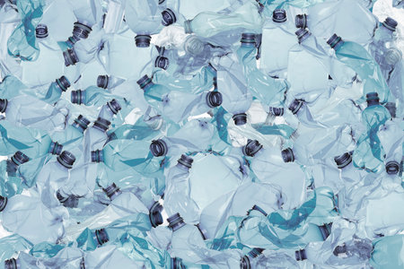 Many used crumpled plastic bottles as background